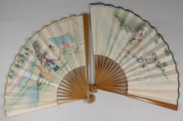 A Chinese fan the paper leaf decorated with three ladies floating on clouds, with bamboo sticks