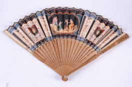 An early 19th century fan, the paper leaf hand decorated with a central classical scene flanked by