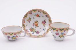 A Champion’s Bristol trio from the ‘Ludlow’ service, the cups with entwined scroll handles,