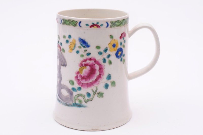 A Bow large mug of flared cylindrical form with grooved loop handle, painted in famille rose colours