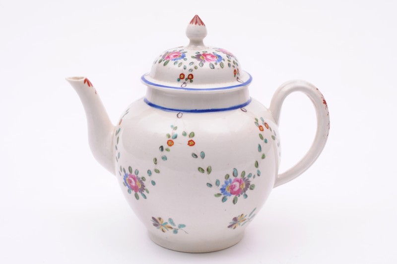 A Staffordshire porcelain teapot and cover probably Baddeley-Littler, of ovoid shape with domed