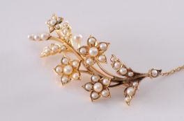 A late 19th century gold and seed-pearl floral spray brooch.