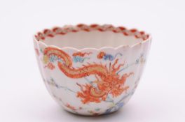 A Chelsea fluted teabowl painted in the Kakiemon palette, the interior with a turquoise and blue