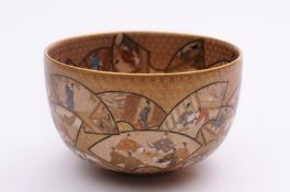 A Satsuma earthenware bowl the interior and exterior decorated with enamels and gilt with numerous