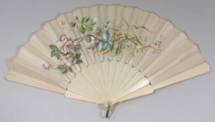 An Edwardian fan the silk leaf hand decorated with floral designs, plain on the reverse, with