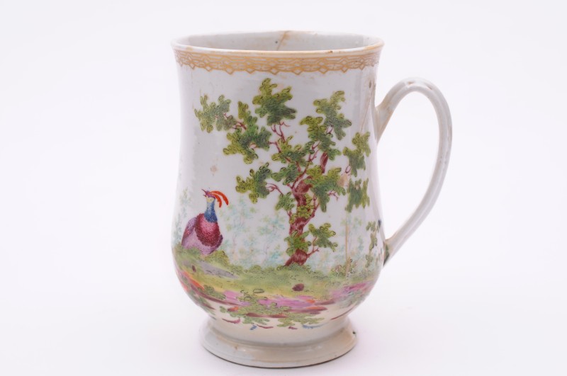 A Plymouth mug of baluster shape with grooved loop handle, painted in ‘Soqui’ style with brightly