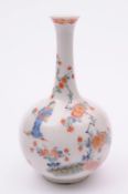 A Bow bottle vase the spherical body with slender neck and everted rim, painted in the Kakiemon