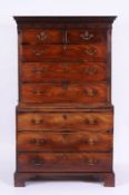 A George III mahogany tallboy, with a dentil cornice, blind fret carved frieze, two short and