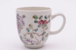 A Bow coffee cup painted in famille rose colours with Oriental flowers and foliage, circa 1755 - 60,
