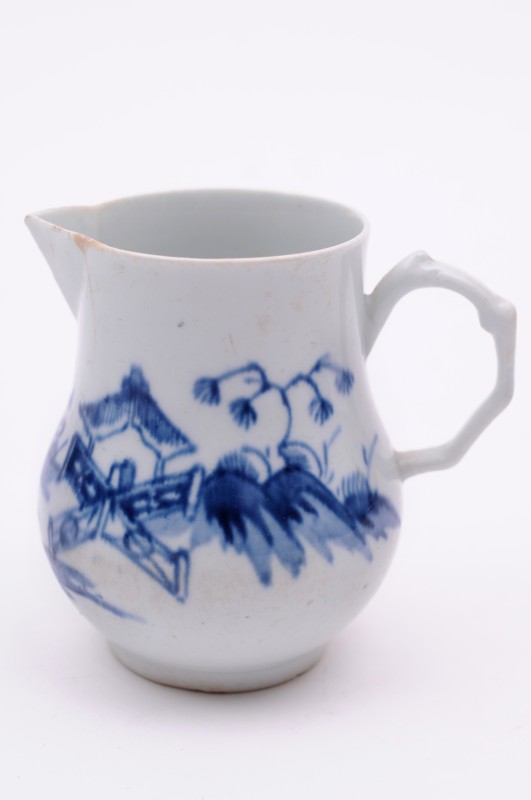 A Longton Hall sparrow beak cream jug of baluster form with delicate moulded handle, painted in blue