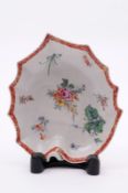 A Bow leaf-shaped dish with stalk handle, the underside moulded with veins, painted in enamel