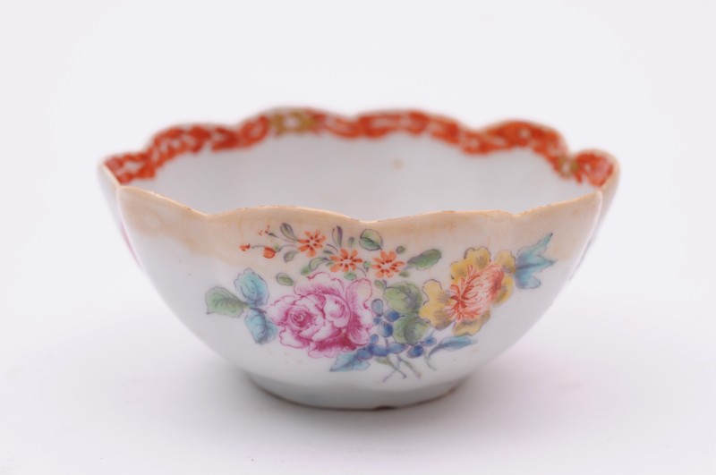 A Bow teabowl of circular fluted form, painted with a floral bouquet, scattered sprays and an