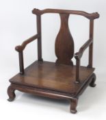 A Chinese rosewood miniature elbow chair with solid splat flanked by shaped arm supports above a