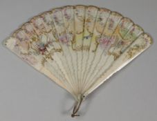 A 19th century miniature brise fan the pierced leaf decorated with painted floral sprays within