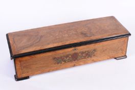 A 19th century musical box  with 33cm. ratchet wind cylinder, and hinged dampener in a rosewood