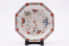 A Bow octagonal deep dish painted in the Kakiemon manner with a dancing boy holding a long ribbon, a