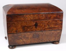A 19th Century burr yew tea caddy  of rectangular outline, with shallow domed hinged lid enclosing