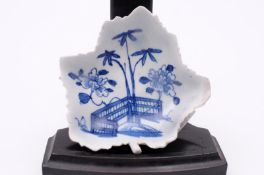 A Bow blue and white pickle dish of vine leaf form painted with bamboo, peony, an angled fence and