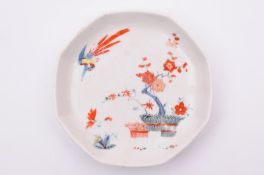A Chelsea saucer of rounded octagonal shape, painted in the Kakiemon palette with a banded hedge,