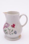 A Bow cream jug of baluster form with plain loop handle and wide footrim, painted in famille rose