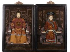 A pair of Chinese reverse glass painted screens depicting a dignatory and his wife, each panel 46
