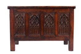 An oak coffer in the 16th Century manner, with linenfold panels to the sides, the four front