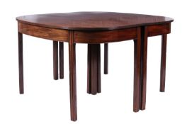 A late George III mahogany D end dining table with reeded edge to the top, plain frieze and on