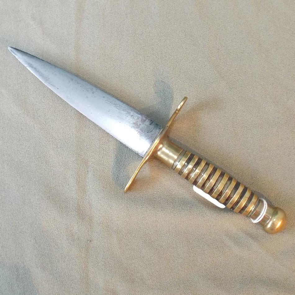 SMALL BRASS HANDLED DAGGER WITH A 13cm BLADE.