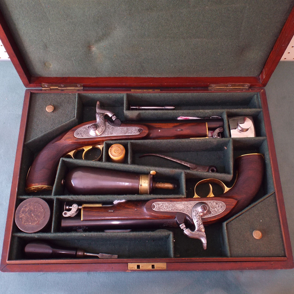 PAIR OF REPLICA 19th CENTURY PERCUSSION PISTOLS BY SMITH LONDON IN OLDER FITTED MAHOGANY BOX WITH