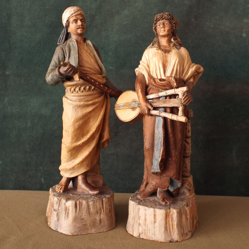 PAIR OF TERRACOTTA GERMAN FIGURES DEPICTING MIDDLE EASTERN PEASANTS. APPX 25cm HIGH.