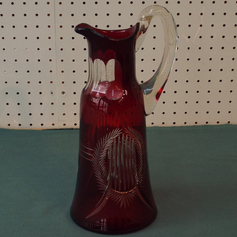 LARGE VICTORIAN RUBY GLASS EWER WITH STAR CUT BASE,