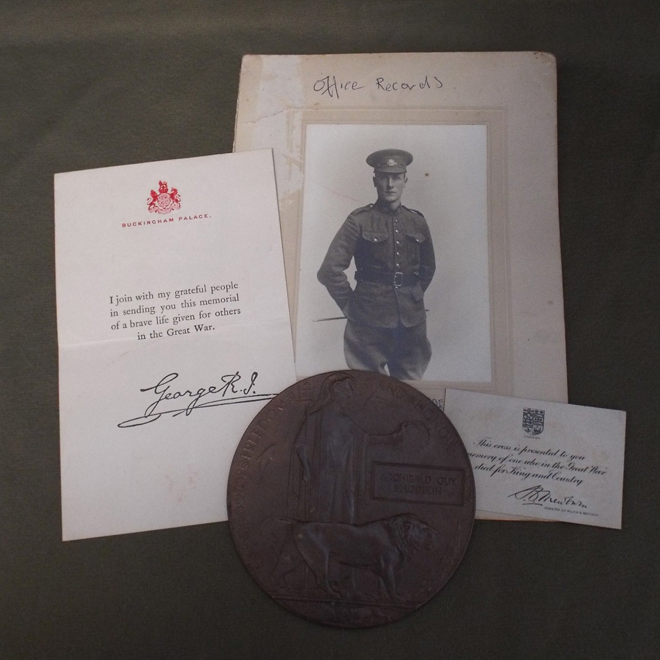 FIRST WORLD WAR BRONZE DEATH PLAQUE AND PAPERWORK INCLUDING PHOTOGRAPH FOR ARCHIBALD GUY MAGDELIN.