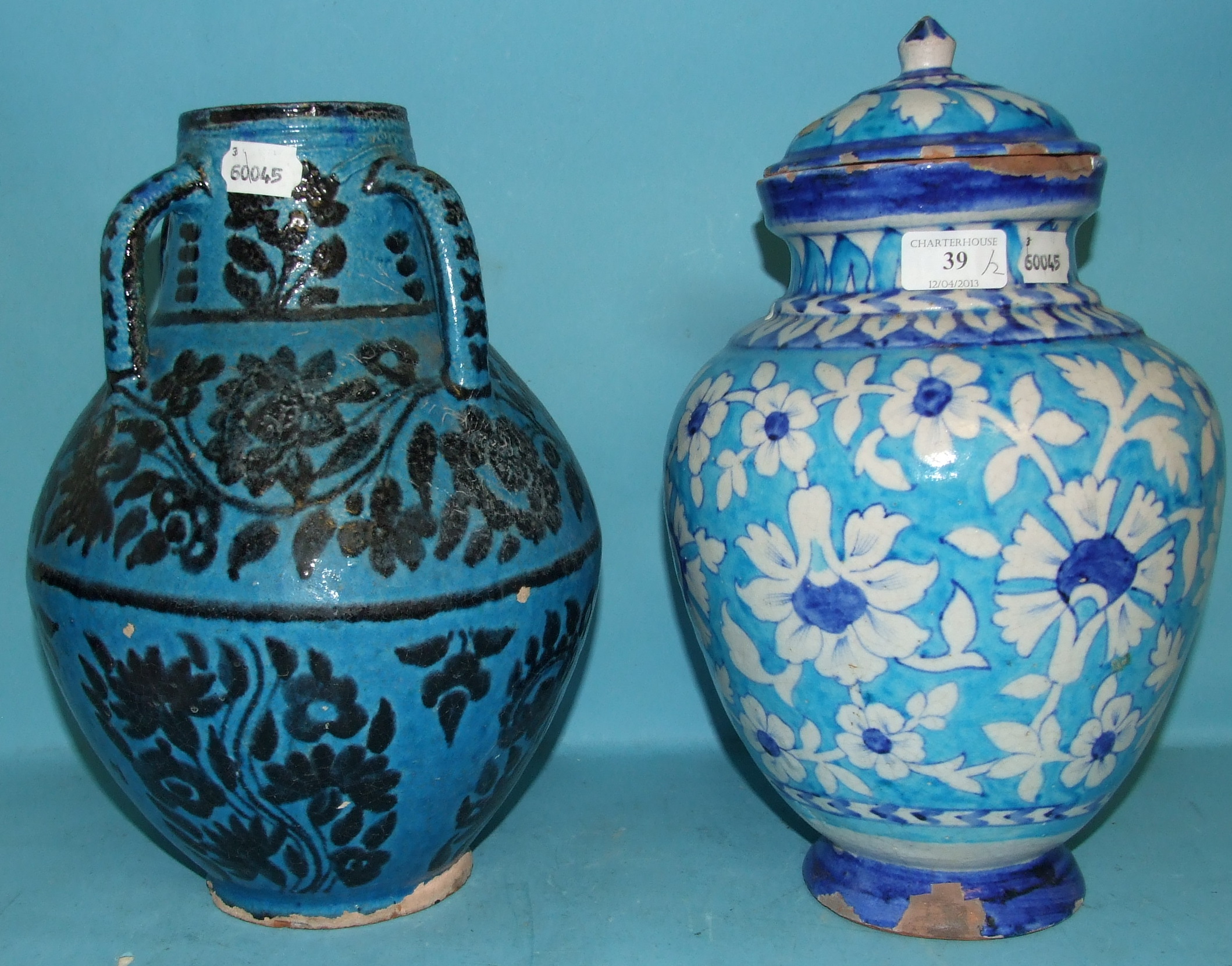 A Persian style vase, having four handles, 32 cm high, and a similar vase and cover (a.f.) (2)