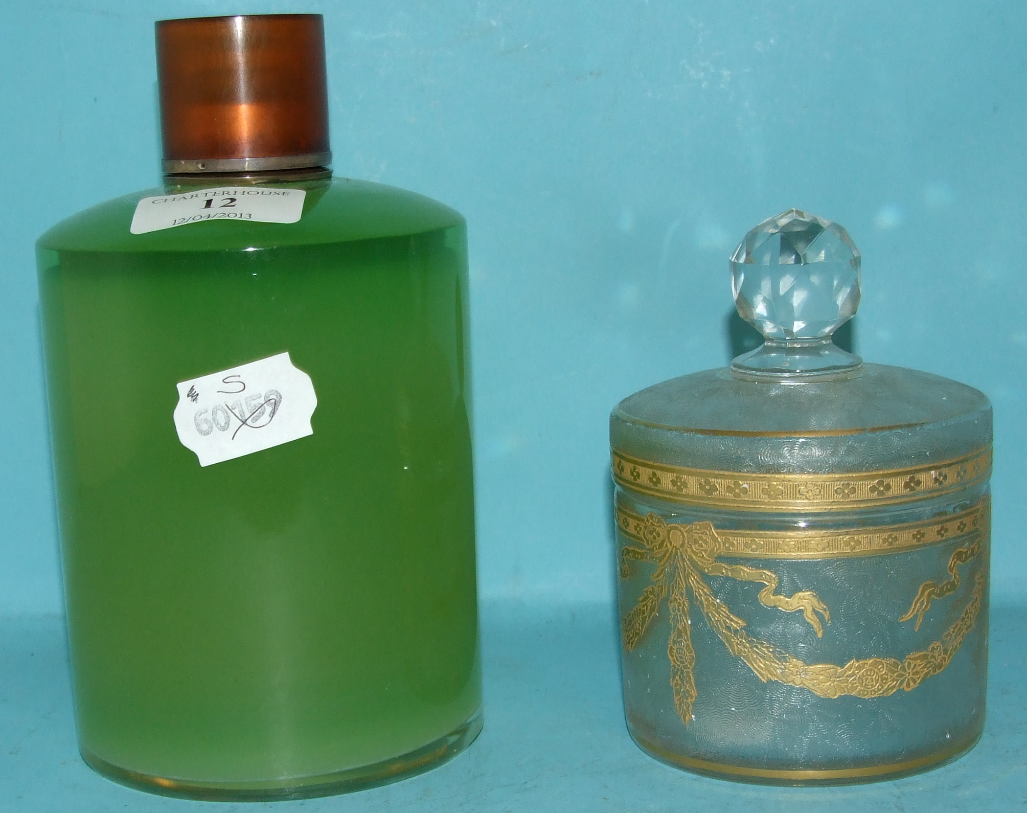 A French green glass perfume bottle, with Continental silver coloured mounts, 17.5 cm high, and a
