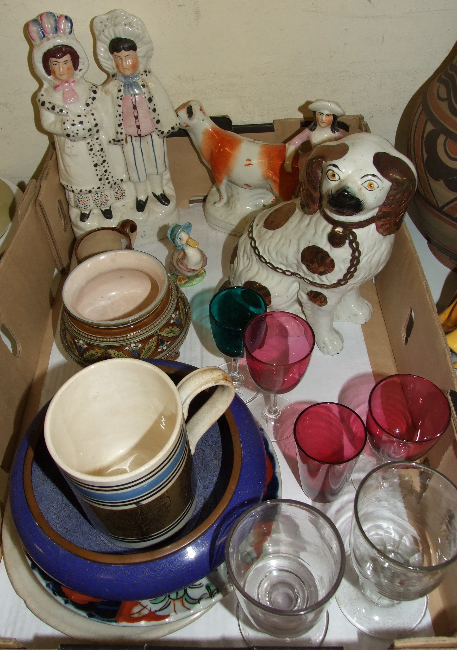 A Staffordshire dog, a Mocha ware cup, a Beswick Beatrix Potter figure, Jemima Puddleduck, BP-2,