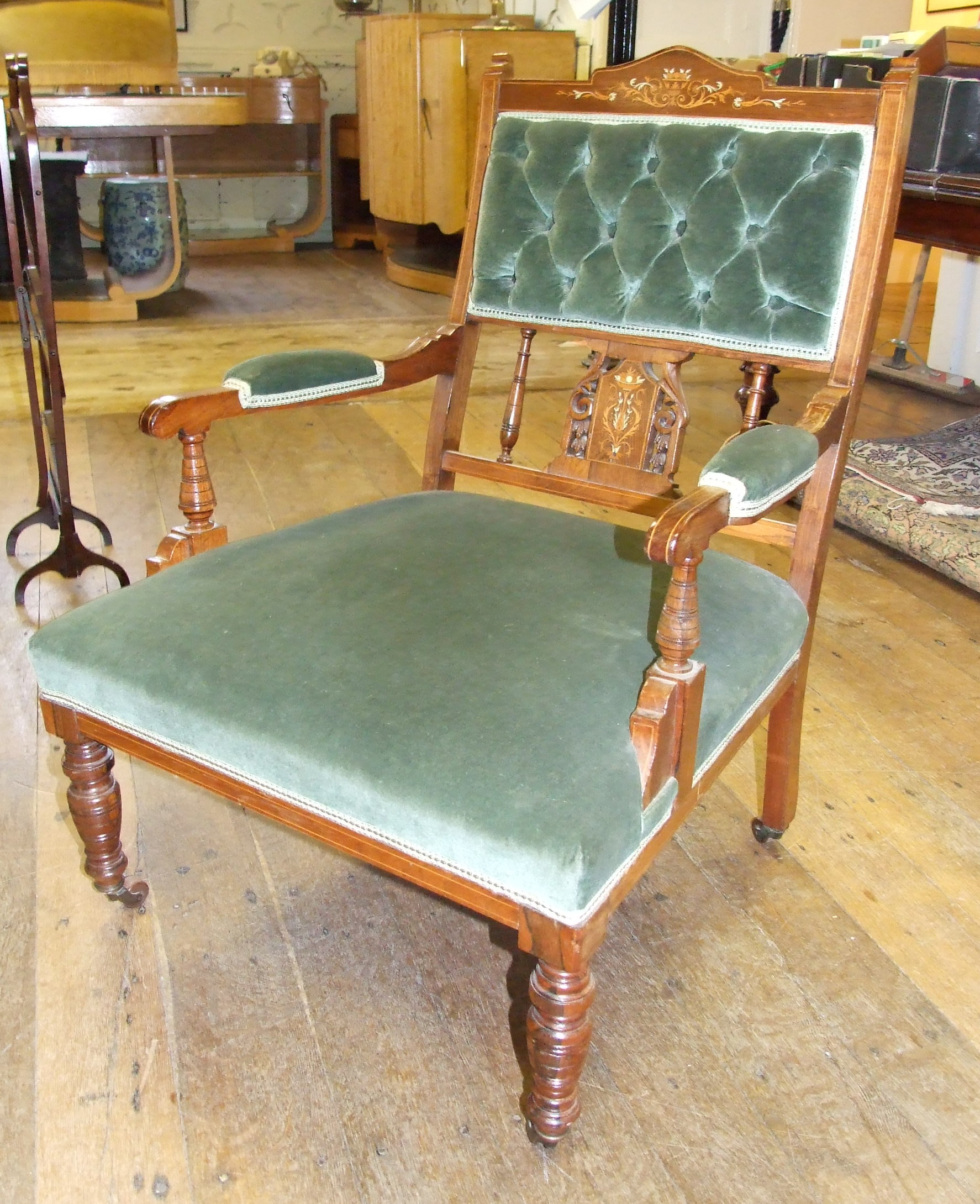 An inlaid rosewood upholstered armchair