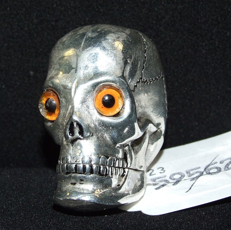 A silver plated vesta, in the form of a skull