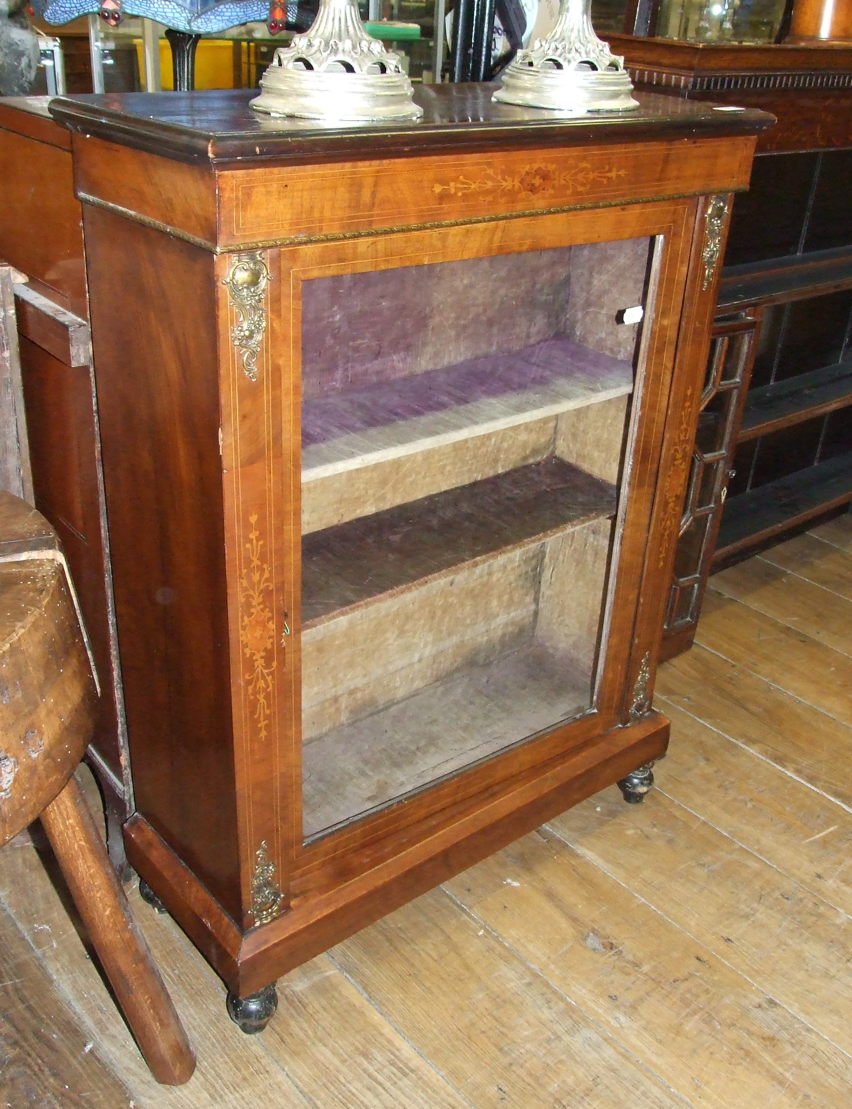 A Victorian walnut pier cabinet, with inlaid decoration and single glazed panel door, 76 cm wide