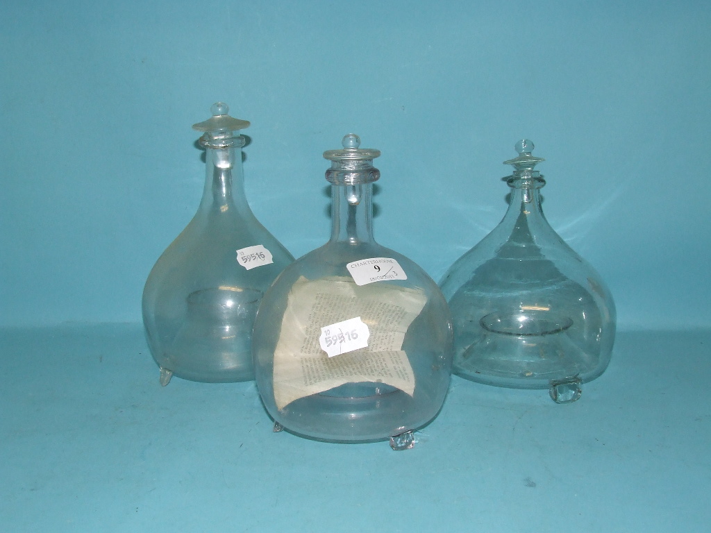 A glass fly/wasp catcher with stopper, 20 cm high, and two others similar (3)