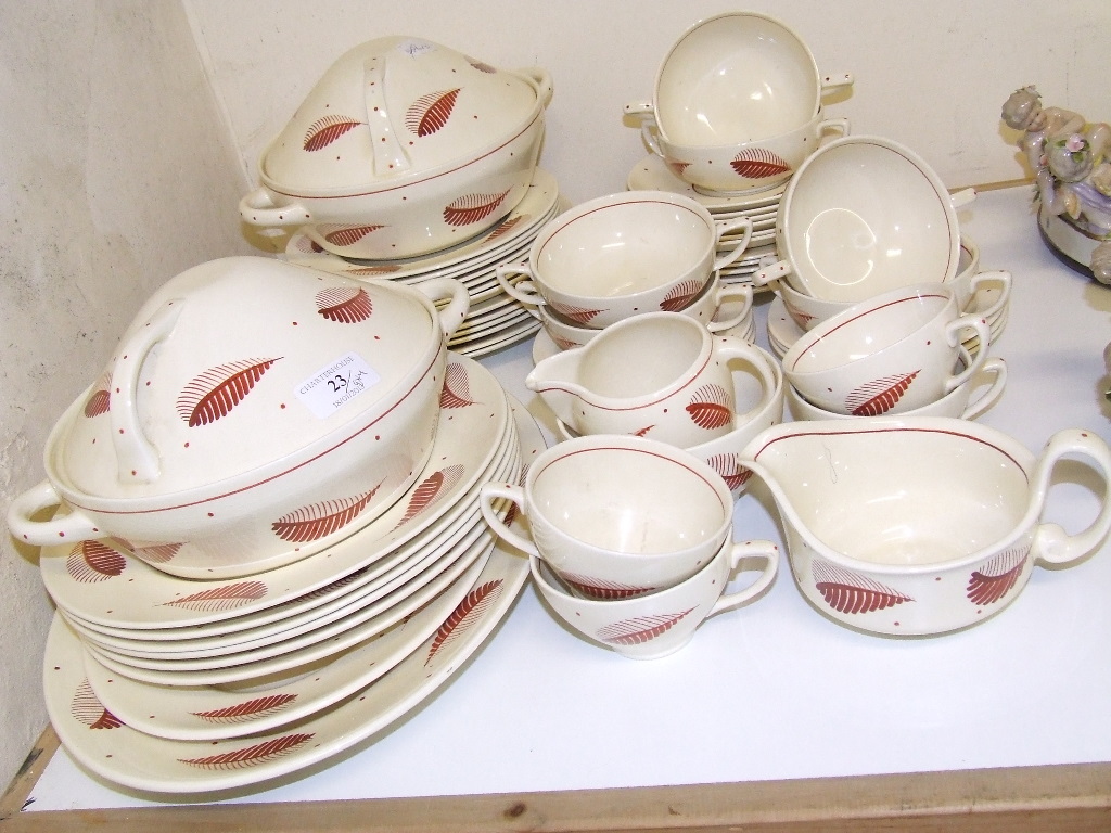 A Susie Cooper Kestrel shape part dinner and tea service, decorated feathers and dots, 2033 (qty)