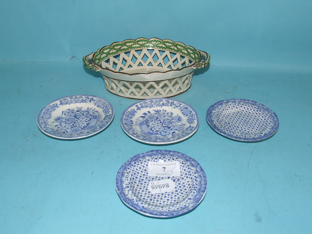 A cream ware chestnut dish, 21 cm diameter and four blue and white porcelain saucers (a.f.) (5)