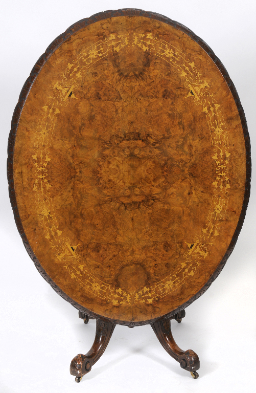 A Victorian oval loo table, the top veneered in burr walnut and inlaid with urns and scrolling