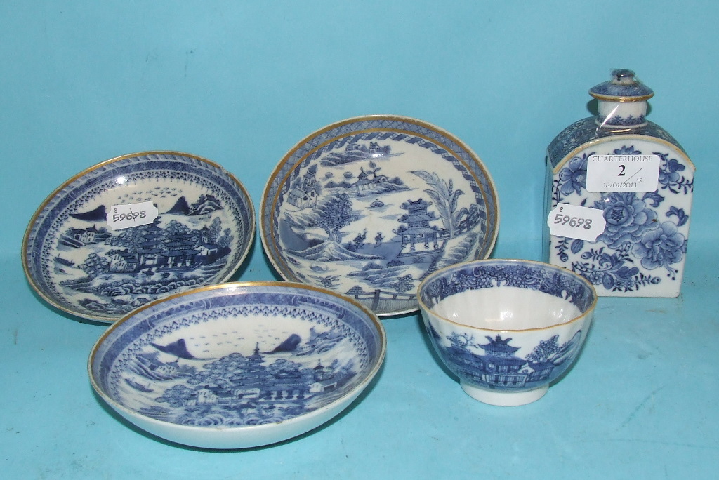 A Chinese blue and white tea caddy and cover, decorated flowers, 12 cm high, a similar tea bowl