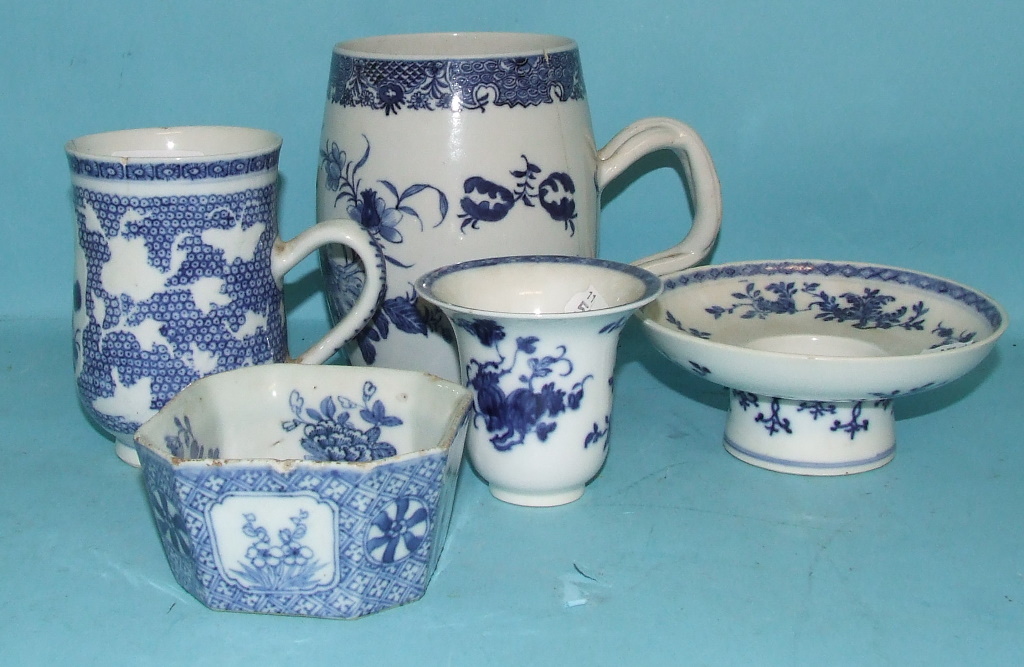 A Chinese blue and white mug, decorated flowers, of barrel form, 14 cm high, another similar and