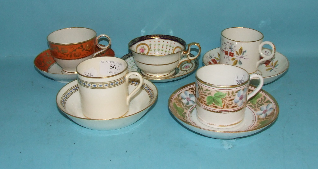 A porcelain coffee can and saucer, with painted and gilt decoration, two others similar, and two tea