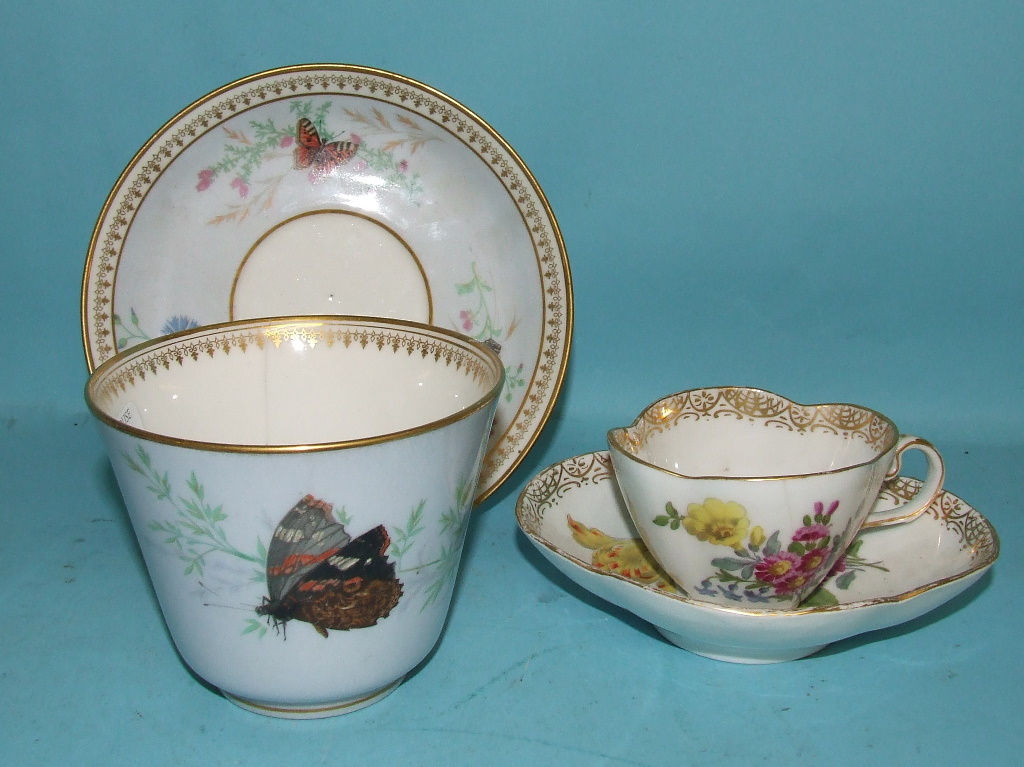 A Meissen tea cup and saucer, decorated flowers, and another similar (a.f) (2)