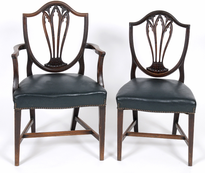 A set of eight George III style mahogany dining chairs, with shield shaped backs, leather