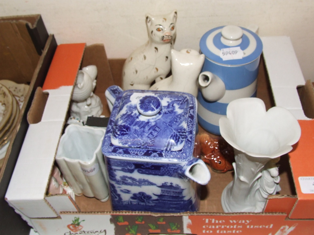 A pair of pottery cats, two fairings and other items