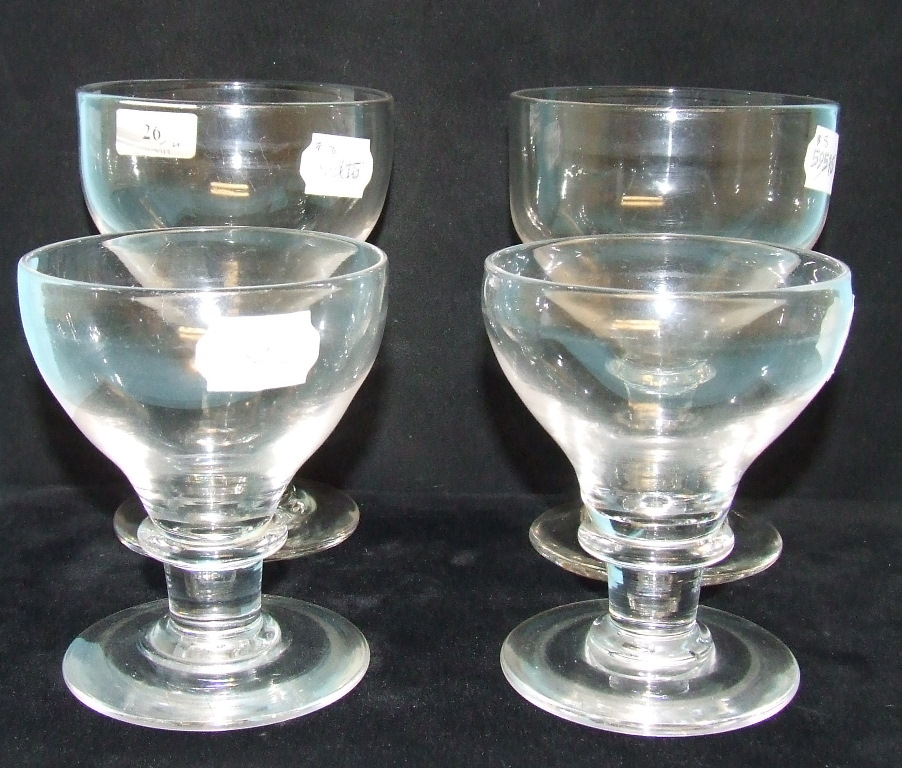A large glass rummer, 15.5 cm high, another similar, and two others smaller (4)