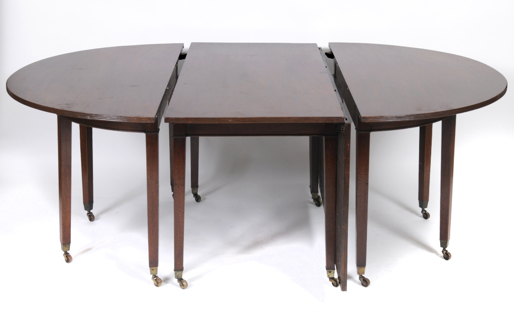 A 19th century mahogany dining table, having a pair of D end sections, on thirteen tapering square